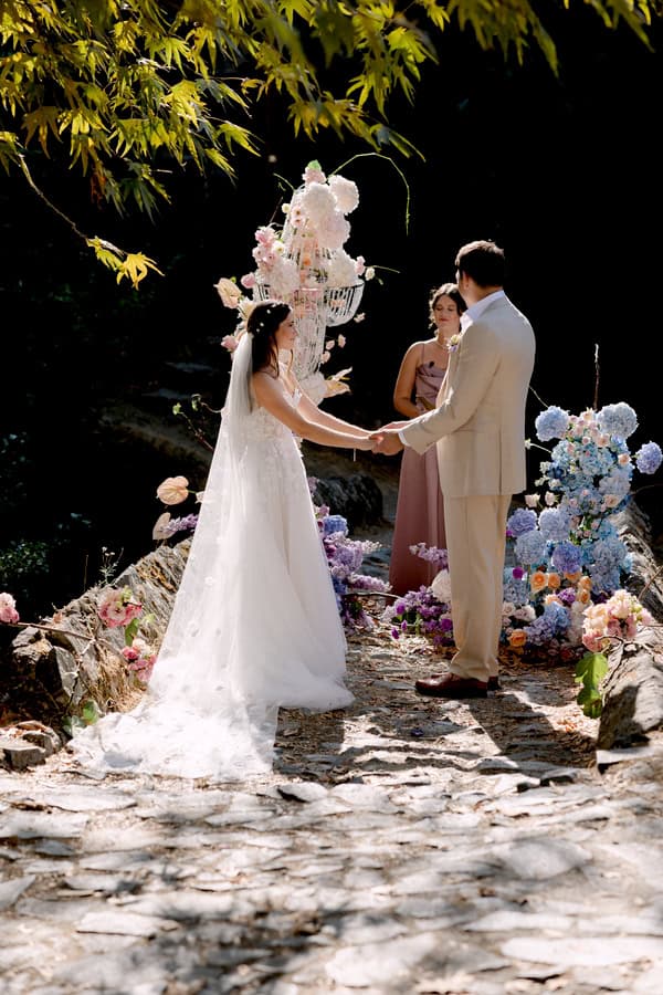 Pastel Colored Wedding Ceremony Stone Bridge Casale Panayiotis