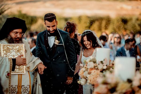 Sunset-hued wedding by the sea at Amaltheia the Place | Marina & Heracles