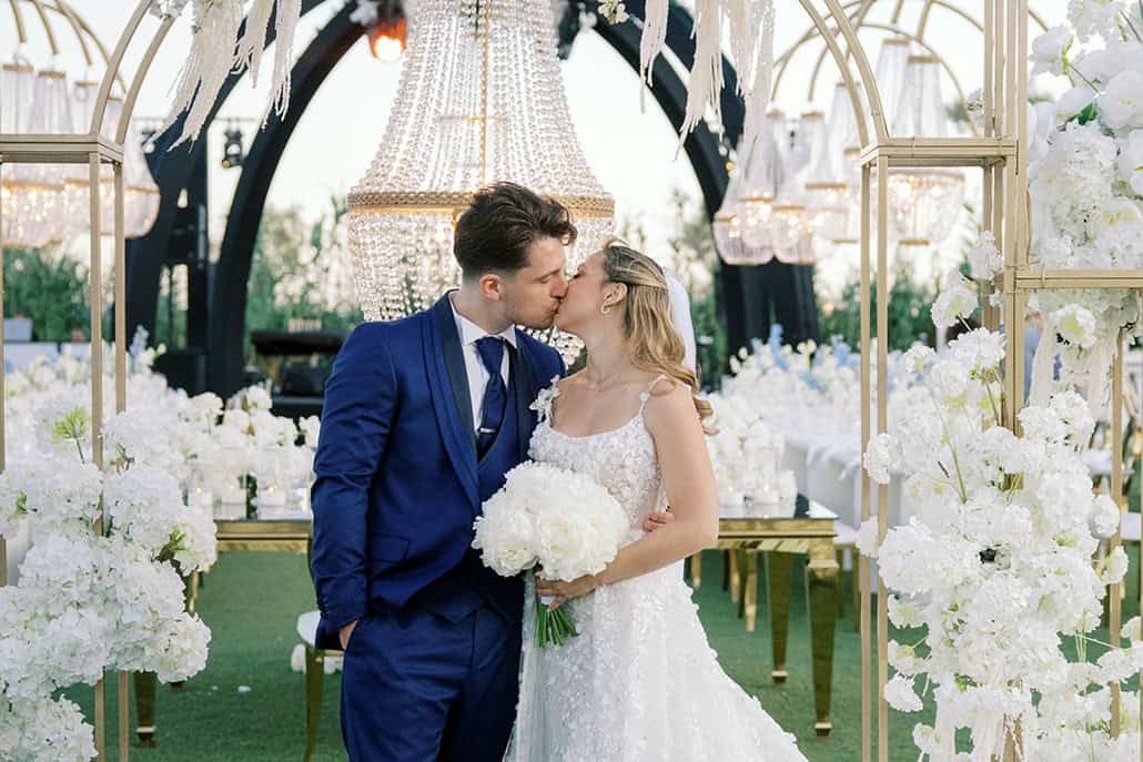 Timeless Athens wedding with chandeliers and lush white flowers | Joanna & Spiros